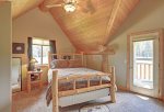 Elk Creek Retreat bedroom with queen bed log . 